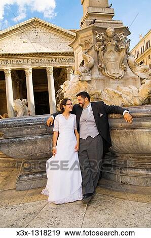 Bride and groom at Pantheon fountain in Rome, Italy View Large Photo Image Stock Photo - Bride and groom at Pantheon fountain in Rome, Italy. Fotosearch