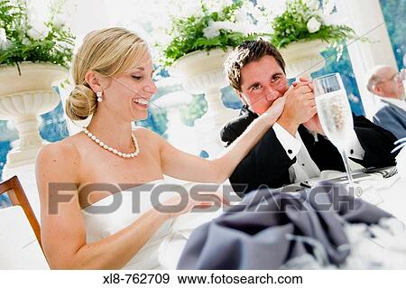 Bride and groom at reception View Large Photo Image Stock Photo - Bride and groom at reception. Fotosearch