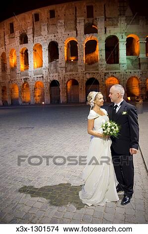 Bride and groom at the Roman Coliseum Rome Italy View Large Photo Image Picture - Bride and groom at the Roman Coliseum Rome Italy. Fotosearch