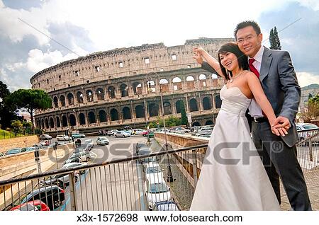 Bride and groom at the Roman Coliseum Rome Italy View Large Photo Image Stock Photo - Bride and groom at the Roman Coliseum Rome Italy. Fotosearch