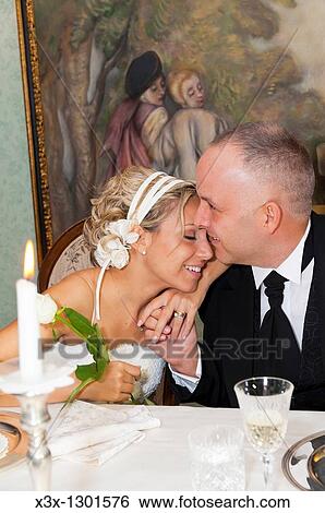 Bride and groom in love View Large Photo Image Stock Photograph - Bride and groom in love. Fotosearch