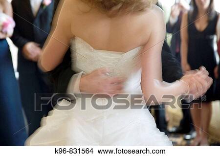 Picture - bride and groom in motion. Fotosearch