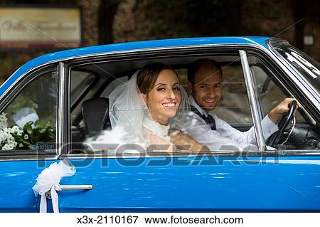 Bride and groom in the wedding car. View Large Photo Image Stock Photo - Bride and groom in the wedding car.. Fotosearch
