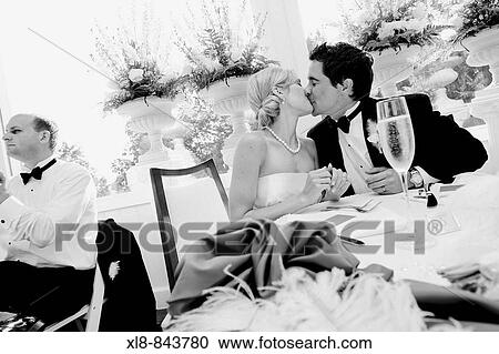 bride and groom kissing at reception View Large Photo Image Stock Image - bride and groom kissing at reception. Fotosearch
