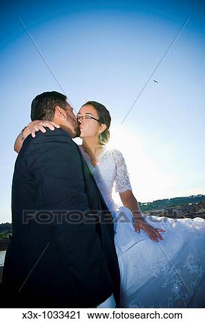 Bride and groom kissing in Giardino degli Aranci in Rome, Italy View Large Photo Image Stock Image - Bride and groom kissing in Giardino degli Aranci in Rome, Italy. Fotosearch