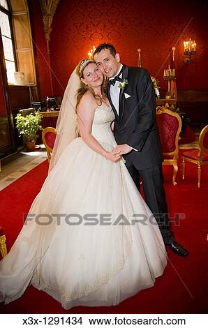 Bride and groom kissing in town hall, Rome, Italy View Large Photo Image Picture - Bride and groom kissing in town hall, Rome, Italy. Fotosearch