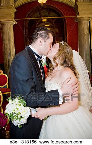 Bride and groom kissing in town hall Rome Italy View Large Photo Image Stock Photograph - Bride and groom kissing in town hall Rome Italy. Fotosearch