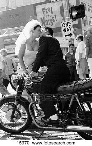 Bride and Groom Kissing on Motorcycle View Large Photo Image Stock Image - Bride and Groom Kissing on Motorcycle. Fotosearch