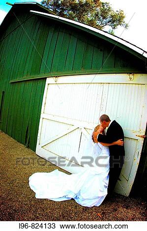 Stock Image - Bride and Groom Kissing. Fotosearch