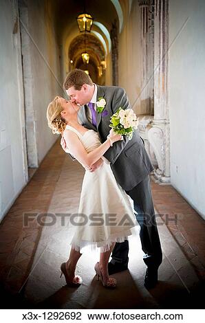 Bride and groom kissing View Large Photo Image Stock Image - Bride and groom kissing. Fotosearch