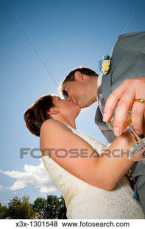Bride and groom kissing View Large Photo Image Stock Photo - Bride and groom kissing. Fotosearch