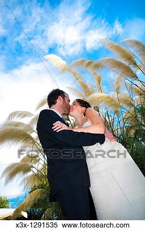 Bride and groom kissing View Large Photo Image Stock Photography - Bride and groom kissing. Fotosearch
