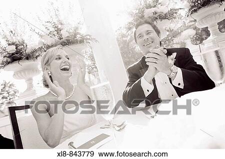 bride and groom laughing at reception View Large Photo Image Stock Photo - bride and groom laughing at reception. Fotosearch