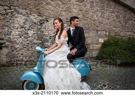Bride and groom on a vespa. View Large Photo Image Stock Image - Bride and groom on a vespa.. Fotosearch
