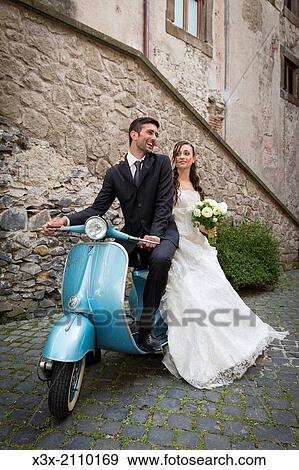 Bride and groom on a vespa. View Large Photo Image Stock Photo - Bride and groom on a vespa.. Fotosearch