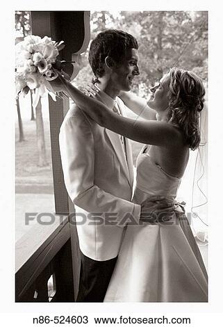Bride and groom outside together View Large Photo Image Stock Image - Bride and groom outside together. Fotosearch