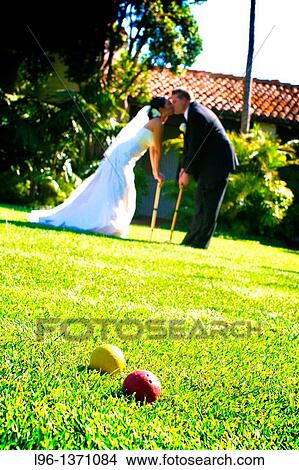 bride and groom playing croquet View Large Photo Image Picture - bride and groom playing croquet. Fotosearch