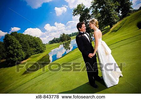 Stock Photo - bride and groom portrait outside, just married. Fotosearch