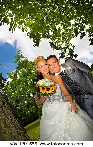 Stock Photography - Bride and groom posing together. Fotosearch