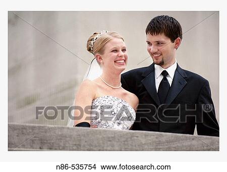 Bride and groom smiling View Large Photo Image Picture - Bride and groom smiling. Fotosearch