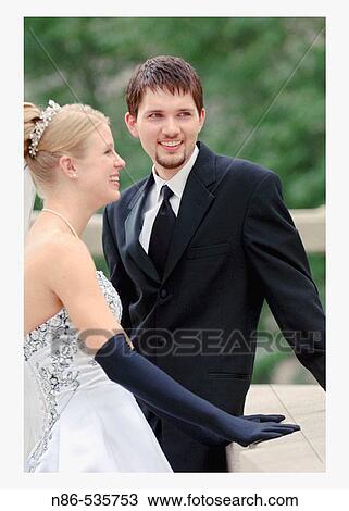Stock Image - Bride and groom smiling. Fotosearch