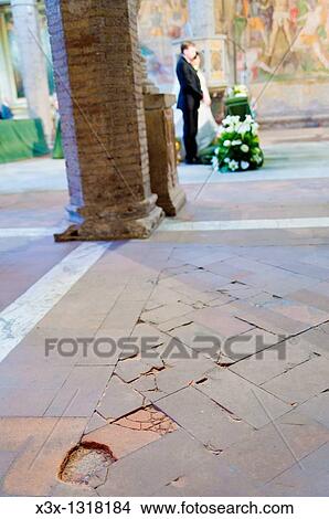 Bride and groom standing at the alter during a church wedding View Large Photo Image Picture - Bride and groom standing at the alter during a church wedding. Fotosearch