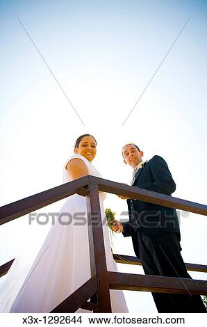 Picture - Bride and groom standing together. Fotosearch