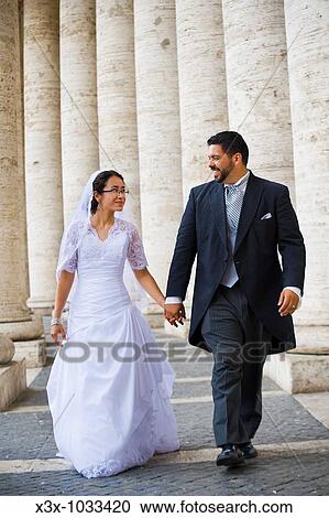 Bride and groom walking in Saint Peter's square Vatican Rome Italy View Large Photo Image Stock Image - Bride and groom walking in Saint Peter's square Vatican Rome Italy. Fotosearch