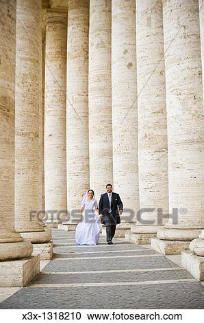 Bride and groom walking in Saint Peter's square Vatican Rome Italy View Large Photo Image Stock Image - Bride and groom walking in Saint Peter's square Vatican Rome Italy. Fotosearch