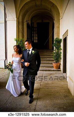 Stock Photography - Bride and groom walking toghether. Fotosearch