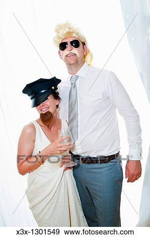 Bride and groom wearing funny disguises View Large Photo Image Stock Photo - Bride and groom wearing funny disguises. Fotosearch