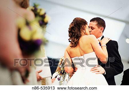 Bride and groom wedding kiss View Large Photo Image Stock Image - Bride and groom wedding kiss. Fotosearch