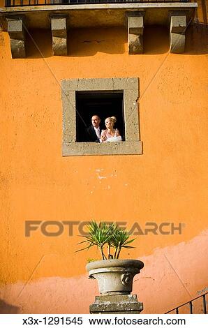 Stock Photography - Bride and groomclose portrait at a window. Fotosearch