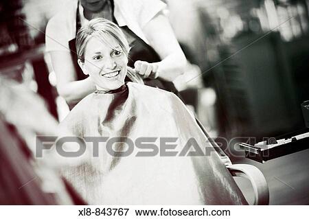 Stock Photo - bride at a beauty salon, hair care. Fotosearch