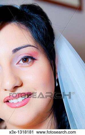 Stock Image - Bride close up with a wedding veil. Fotosearch