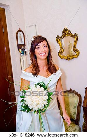 Bride holding the wedding bouquet View Large Photo Image Stock Photograph - Bride holding the wedding bouquet. Fotosearch