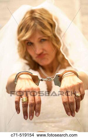 Bride in handcuffs View Large Photo Image Picture - Bride in handcuffs. Fotosearch