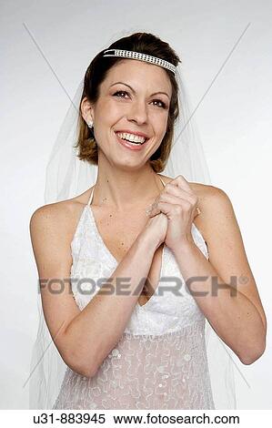 Bride in her 20s looking up thinking View Large Photo Image Stock Photography - Bride in her 20s looking up thinking. Fotosearch
