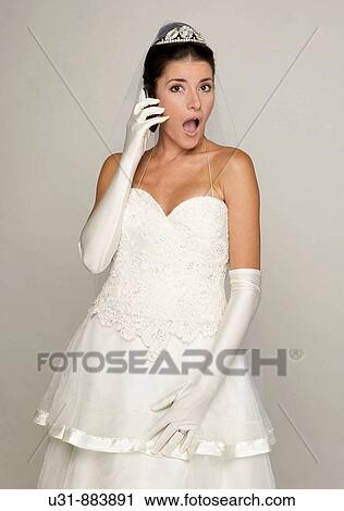 Bride in her 20s looks amazed/disgusted at cell phone View Large Photo Image Stock Image - Bride in her 20s looks amazed/disgusted at cell phone. Fotosearch