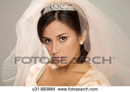Bride in her 20s looks at the camera angry View Large Photo Image Picture - Bride in her 20s looks at the camera angry. Fotosearch