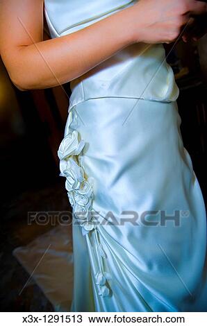Bride in wedding dress with a bow View Large Photo Image Stock Image - Bride in wedding dress with a bow. Fotosearch