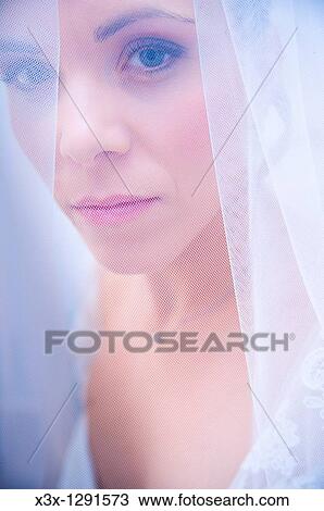 Bride in wedding veil looking back View Large Photo Image Stock Image - Bride in wedding veil looking back. Fotosearch
