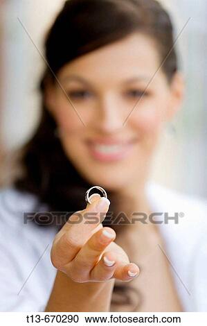 Bride is happy with wedding ring in hand View Large Photo Image Stock Image - Bride is happy with wedding ring in hand. Fotosearch