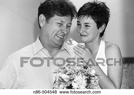 Bride laughing, smiling with father View Large Photo Image Stock Photo - Bride laughing, smiling with father. Fotosearch