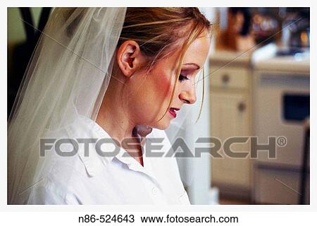Bride looking down View Large Photo Image Stock Image - Bride looking down. Fotosearch