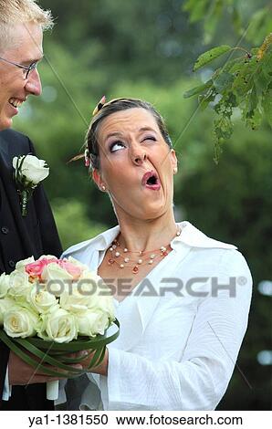 Bride making a funny face to her new husband, France View Large Photo Image Stock Image - Bride making a funny face to her new husband, France. Fotosearch