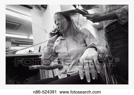 Bride on phone during hair appointment View Large Photo Image Stock Image - Bride on phone during hair appointment. Fotosearch
