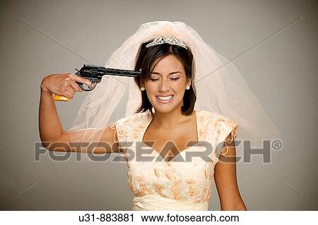Bride points a gun to her head View Large Photo Image Stock Image - Bride points a gun to her head. Fotosearch