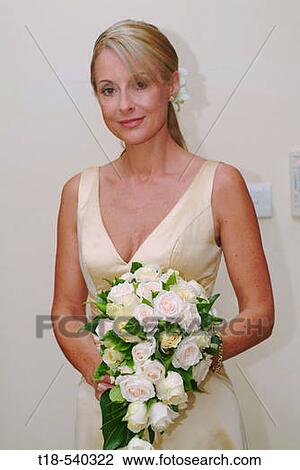 bride posing holding hand bouquet View Large Photo Image Stock Image - bride posing holding hand bouquet. Fotosearch