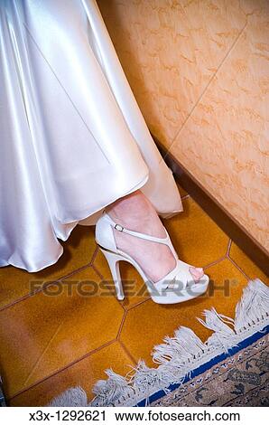 Bride wearing white wedding shoes View Large Photo Image Stock Image - Bride wearing white wedding shoes. Fotosearch